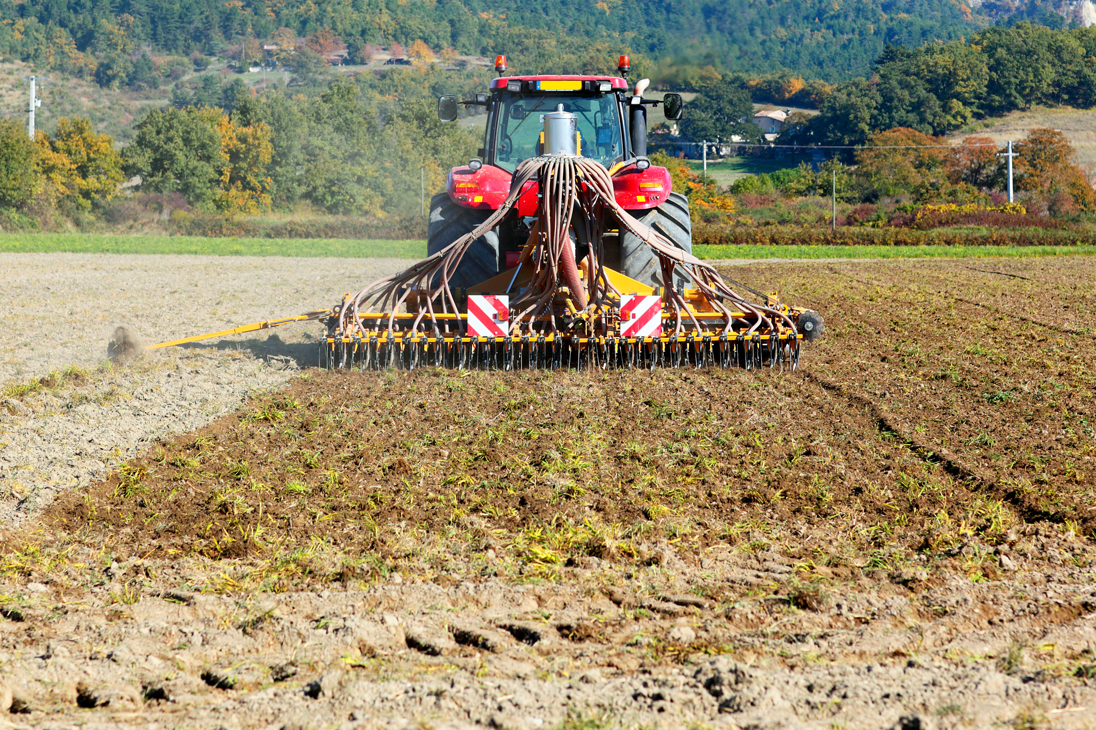 ploughing-heavy-tractor-during-cultivation-agriculture-works-field-with-plough.jpg