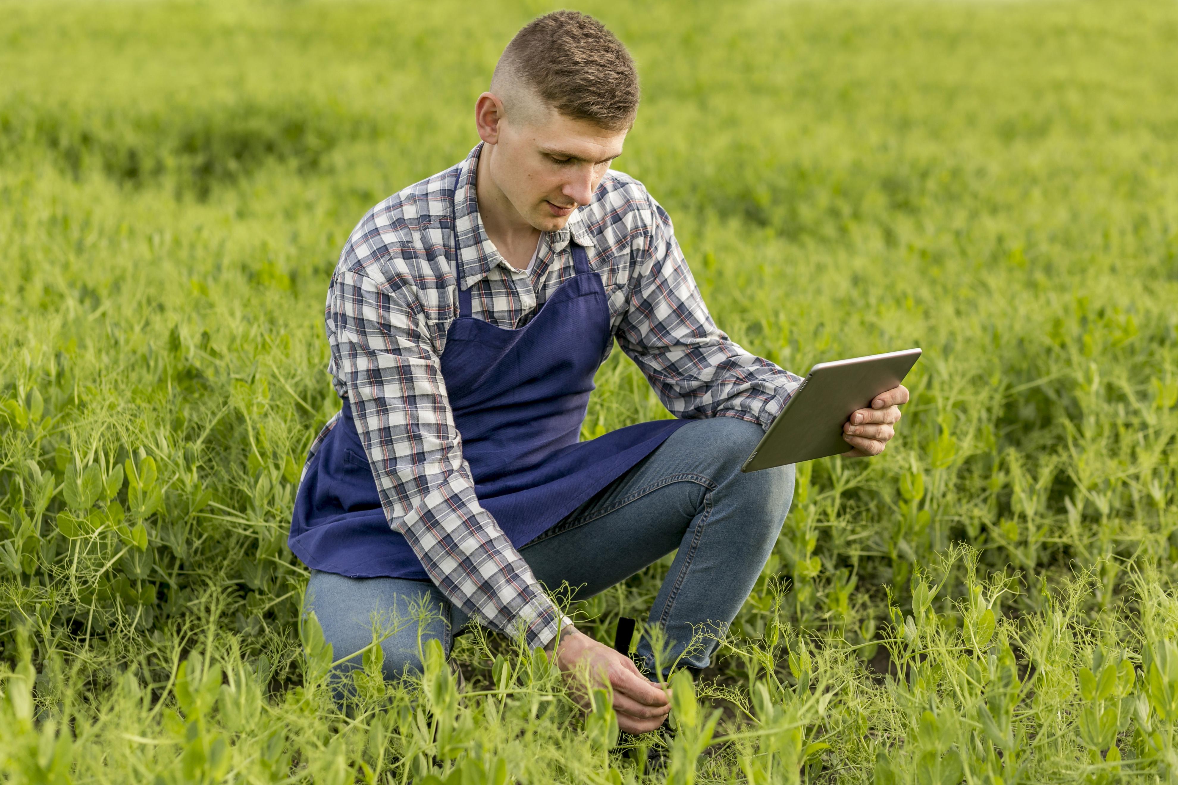 high-angle-farmer-with-tablet.jpg