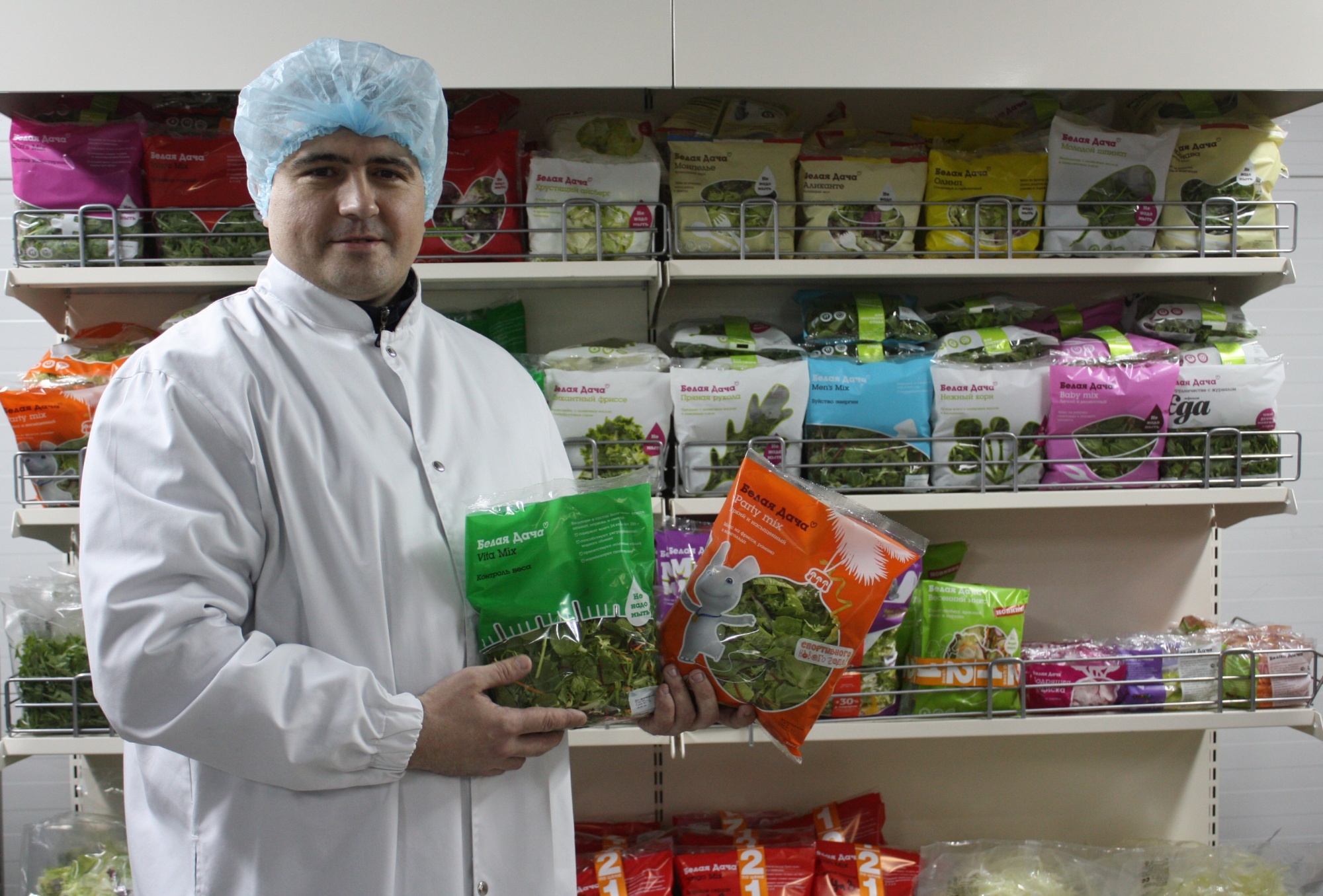 Belaya Dacha customer with product samples (PR shot).JPG
